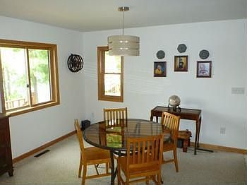 The Dining area is adjacent to the Kitchen and Living Room and also has a great view of the lake.