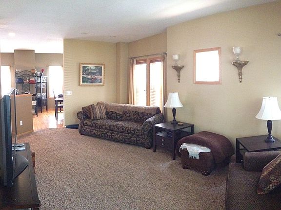 Living room and view into kitchen and dining room