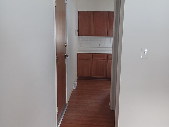 walk through from dining room to kitchen passing the 1/2 bath