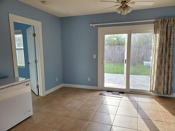Third bedroom entry and back patio view