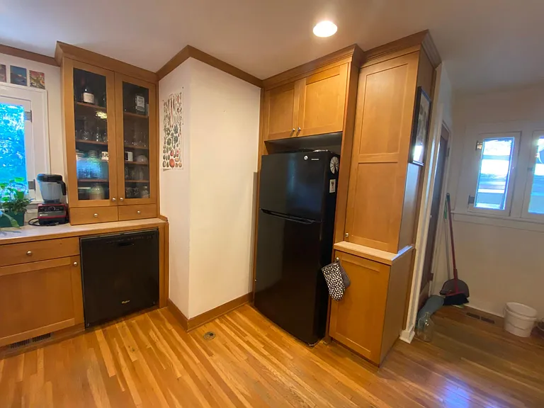 April 2025-Pantry and dishwasher and on the left the window out to the backyard