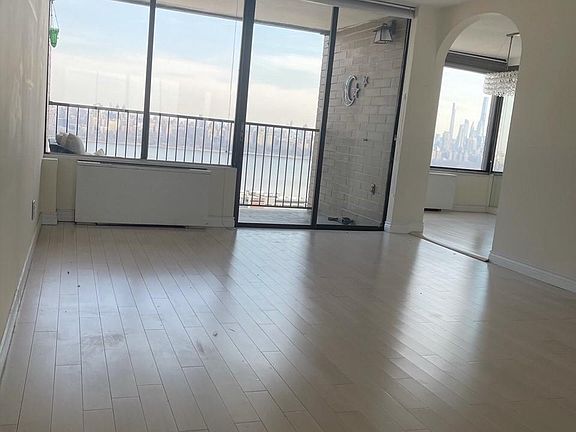 Living room, overlooking balcony with arch view into dining room