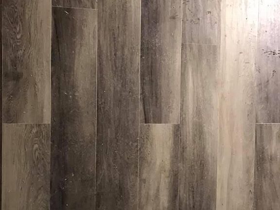 Luxury waterproof flooring installed in bathroom, kitchen, and laundry room.