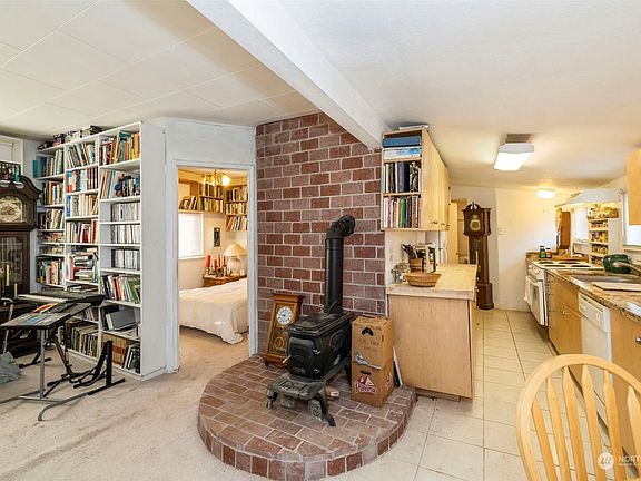 Wood stove in living room.>