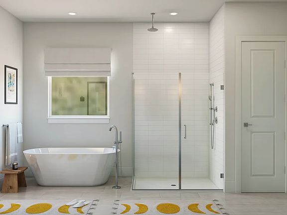 Primary bath with glass shower enclosure and freestanding tub