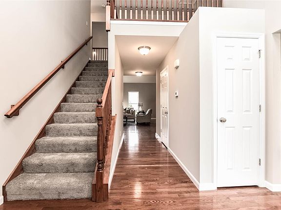 Loft above looks over foyer and great room. Formal dining to the right. Foyer closet for coats, etc.
