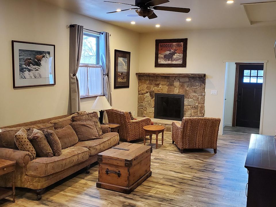 Living room with natural stone fireplace