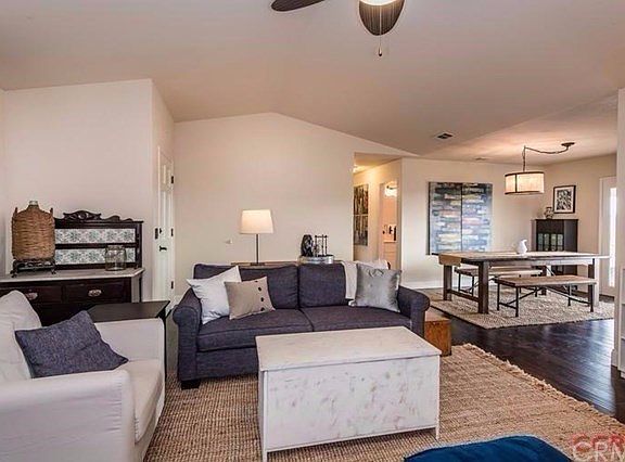 The living space flows nicely into the dining area and kitchen with sliding doors that take in the v