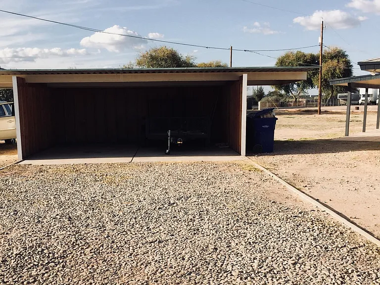 2 car covered car port with extra overhang storage space