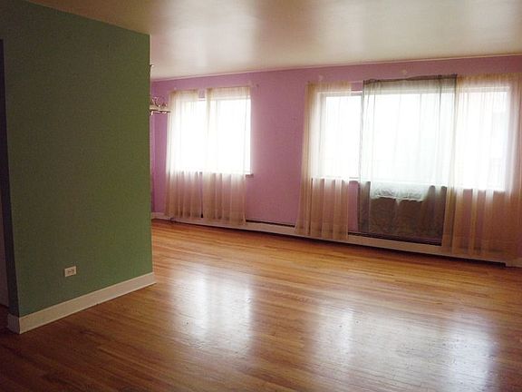 Spacious Living Room with Hardwood Floors