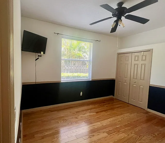 Bedroom #4 with large closet organizer, and wall mounted TV* (for convenience only).