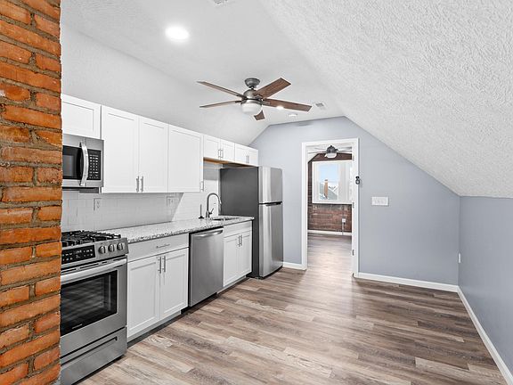 Common area (front): kitchen, seating, dining areas