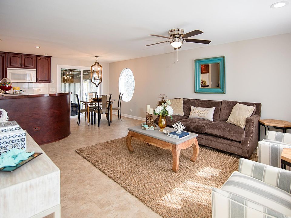 Living room and kitchen area that opens to the 3 season porch