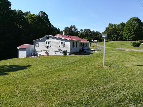 left side view of house and storage building