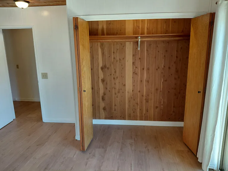 Large bedroom closet with excellent storage space.
