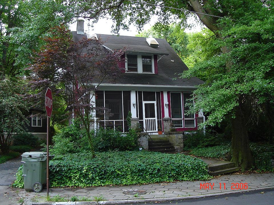 Front view shows the Glass Porch on Right and the Screen Porch on left side. This photo is still current.
