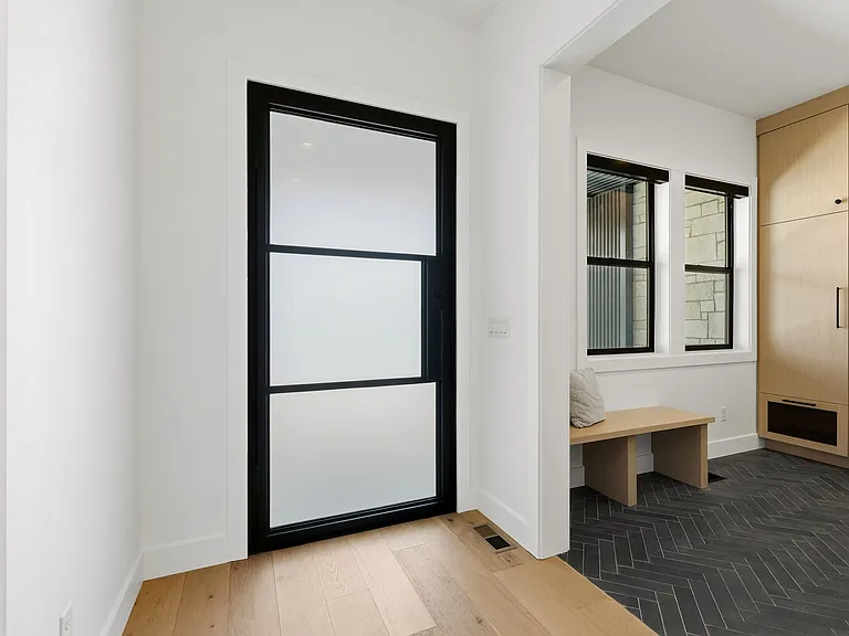 Custom front door. Mud room + Lockers