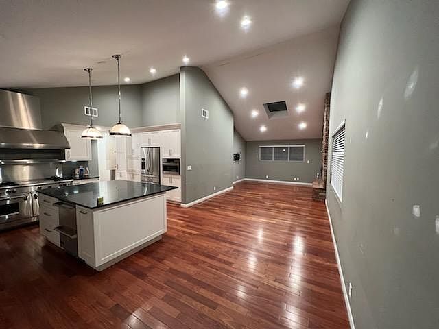 Kitchen, dinning room and family room combo with fireplace