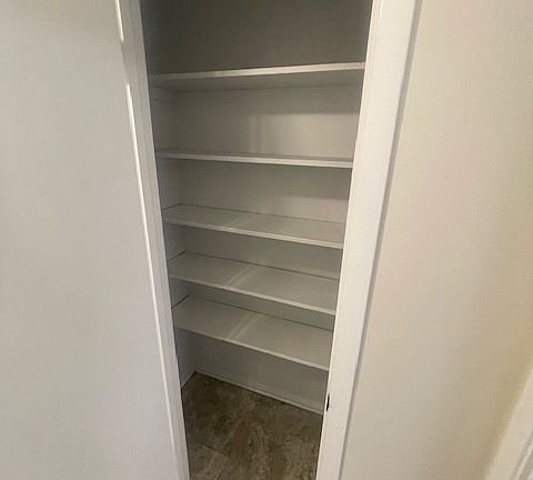 Spacious pantry/ extra storage off of the kitchen