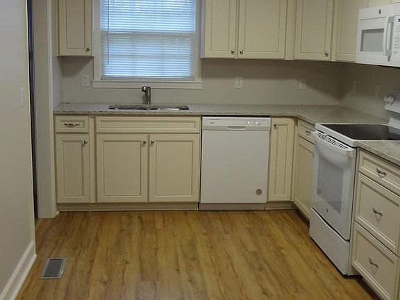 Kitchen to laundry room on left