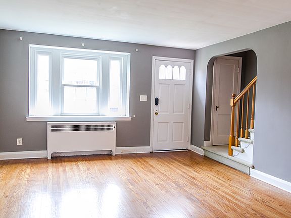 Living Room looking at front door with freshly painted walls