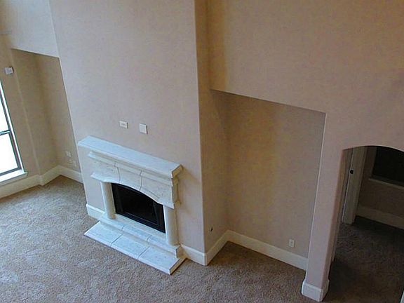 Birdseye View of Living Room and gorgeous stone fireplace from Upstairs