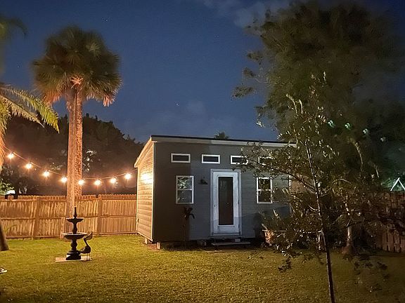 Backyard with outbuilding. 