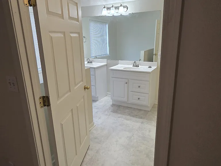 View from the primary bedroom to bathroom