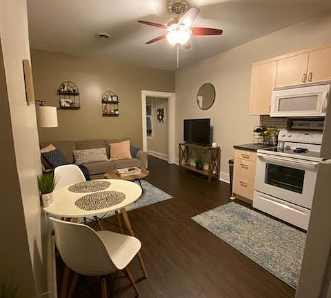 Entrance to apartment. Open concept for living/dining/kitchen. New flooring.
