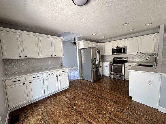 Kitchen with granite countertops and tile backsplash