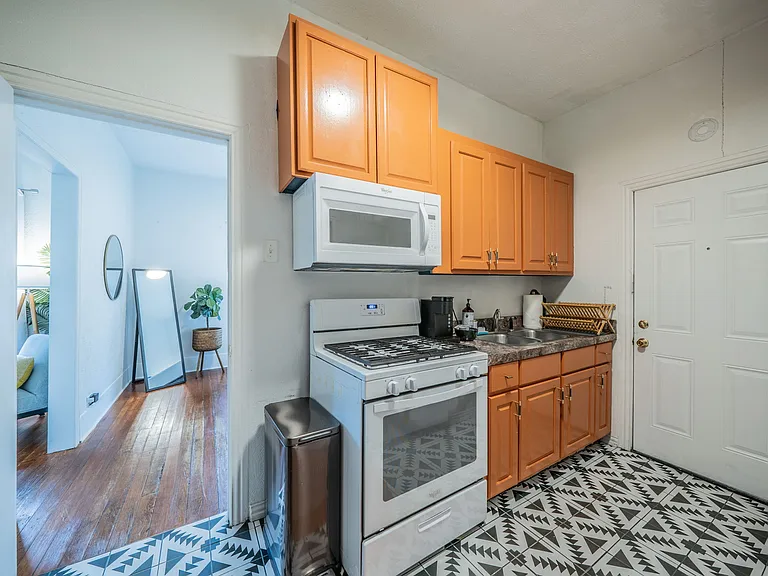 A fully equipped kitchen featuring vibrant decor and modern essentials.