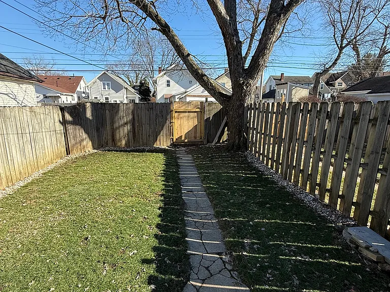 Fully fenced in backyard with privacy fence. Back gate leads to back pad for parking in rear