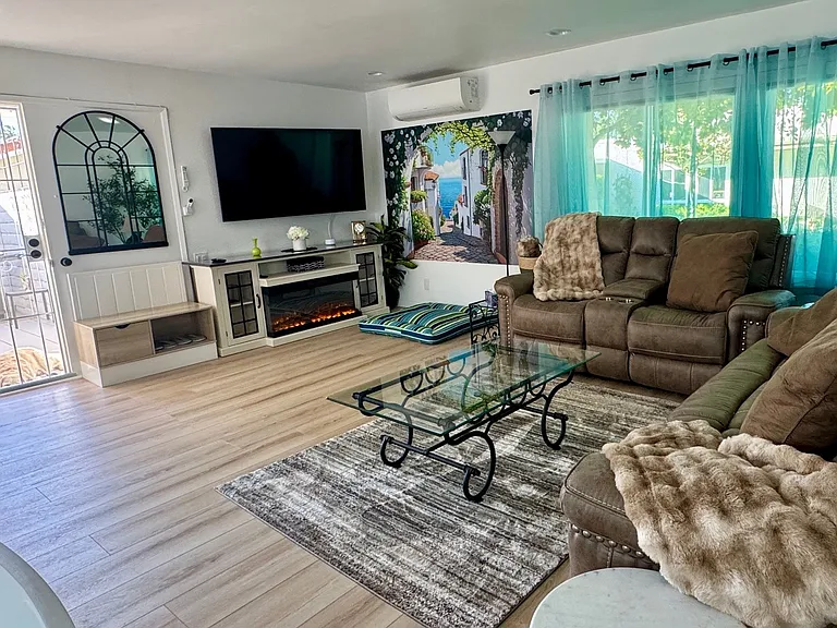 Reclining couches to get comfy and watch a movie, with blackout remote controlled blinds