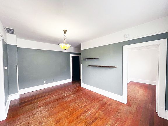 Dining room
Door on right leads to front bedroom. 
Door in center is top of entry stairwell