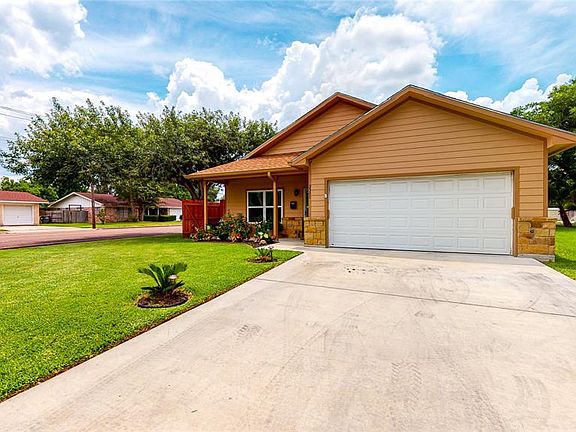 What a delightful, inviting curb appeal with covered front porch!