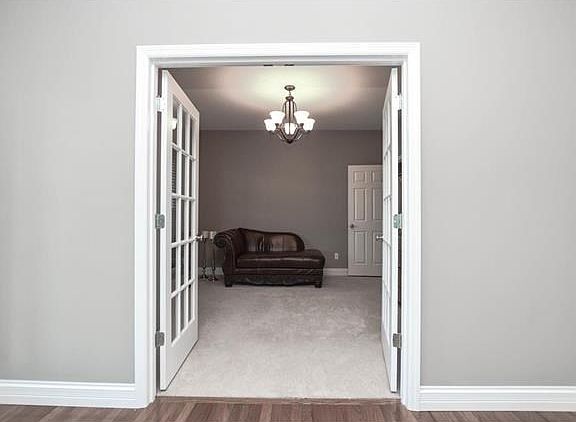 Dining room has french doors but can be removed. Area was used for a short period of time for a bedroom for mother-in-law. Has 2 small closets that would make great open shelving or extra storage.