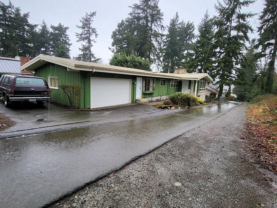 Pristine Mid-Century Home in quiet Angle Lake. Located just blocks away from 1-5 access and walking distance to the Light Rail! Partial lake views.