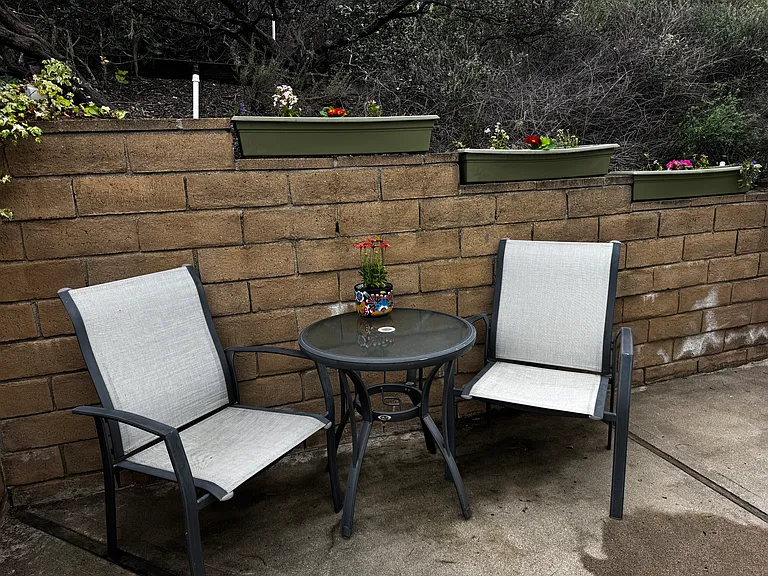 Small exterior table and chairs outside your unit for your personal use. Nearby hot tub available for use.
