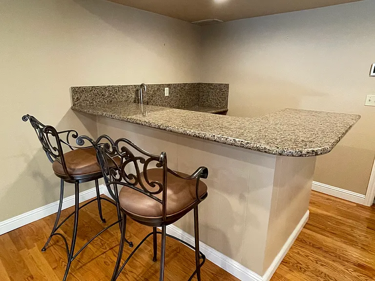 Bar with granite counter top cabinets
