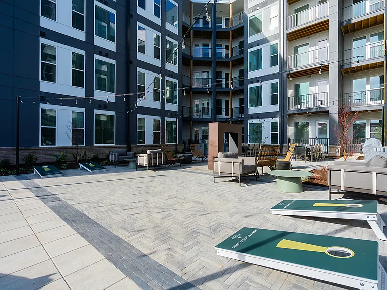 Hideaway Courtyard with a Dining Area, Grilling Station, and Cornhole