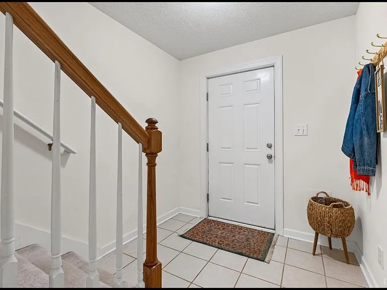 Terrace level entrance to 3rd room with 1/2 bath and garage access.