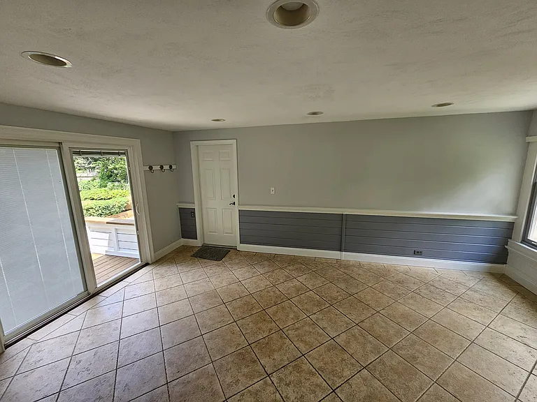 Dining Room _ View 1
Dining room with heated tile floors, natural light, and direct access to the backyard and garage.