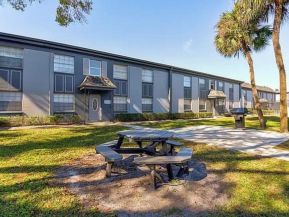 Experience outdoor relaxation in the serene courtyard of our modern apartments.