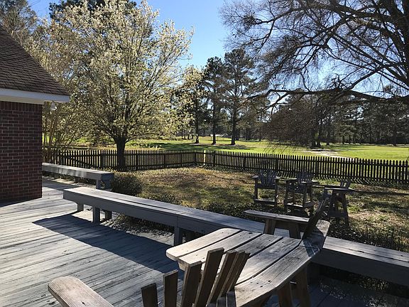 Rear deck and view of golf course beyond.