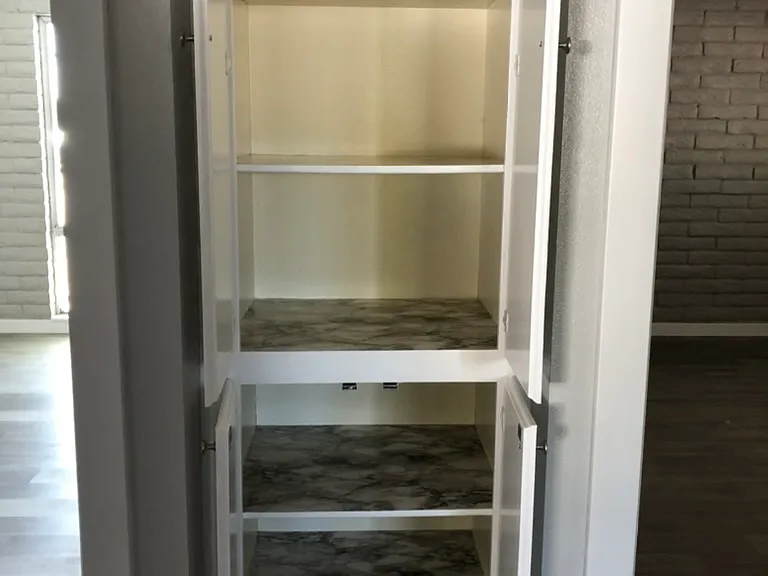 Linen closet between bedrooms