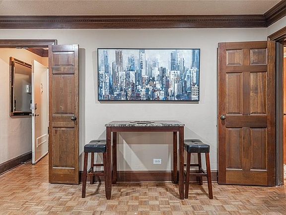 Image 5: Beautiful mouldings.  Vintage lovely parquet flooring.  Tastefully furnished.