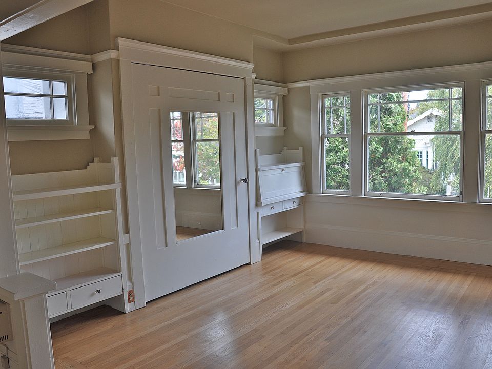 Front room with built-in, fold-down Murphy bed (behind mirrored door) and built-in fold-out desk