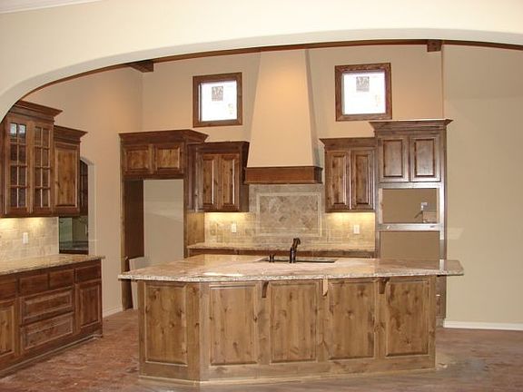 Granite kitchen with alder cabinets, large pantry, oversized eating bar & nook