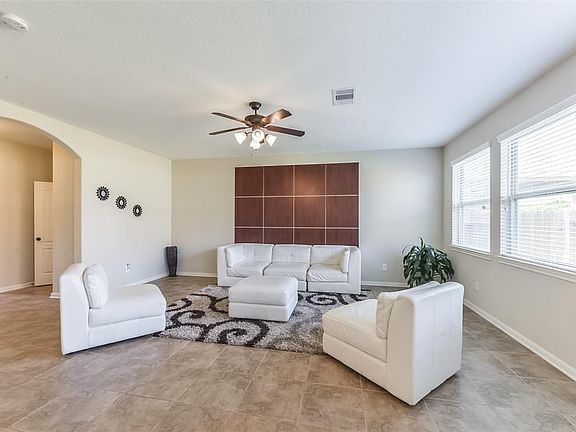 Super contemporary living room with custom wood panel wall