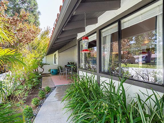 Wrap around the enclosed backyard. The waist-high fence allows views across the Back Bay, South Coast Plaza, and lush green belts.
